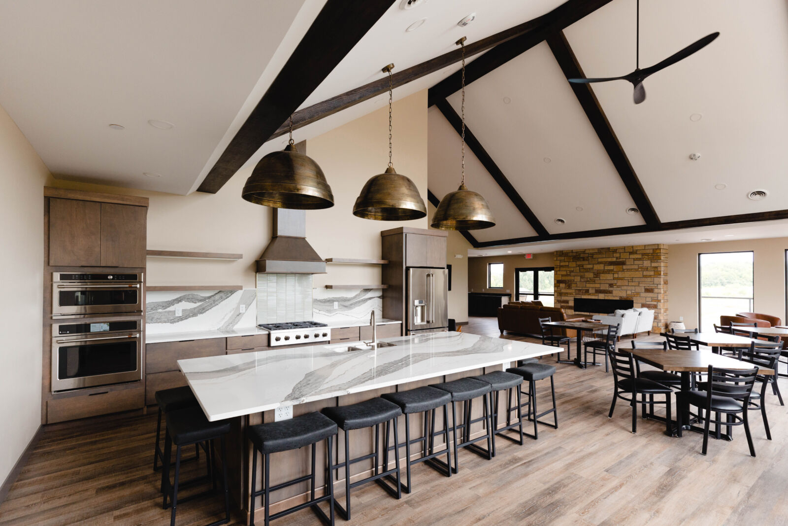 Siesta Hills Clubhouse Commercial Kitchen and Event Space Mankato Minnesota Siesta Hills clubhouse commercial kitchen with large island seating for resident events in Mankato Minnesota