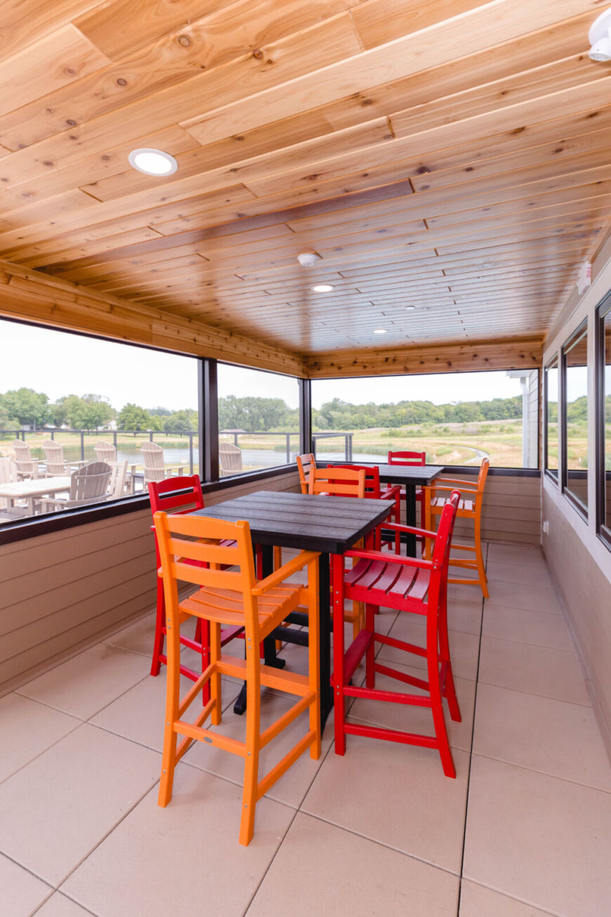 Siesta Hills screened patio with seating at clubhouse in Mankato Minnesota