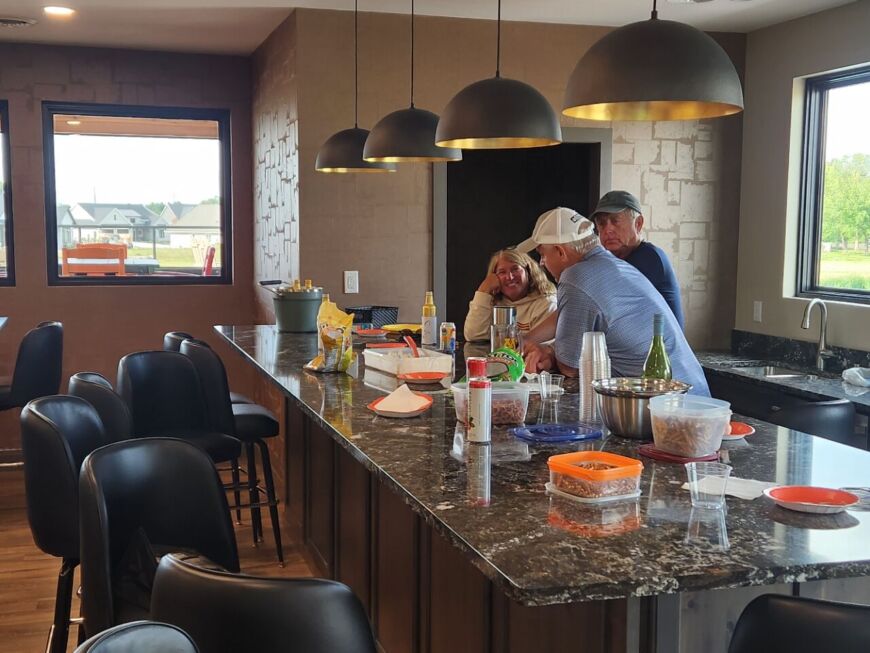 Siesta Hills residents enjoying happy hour in the clubhouse pub room in Mankato Minnesota