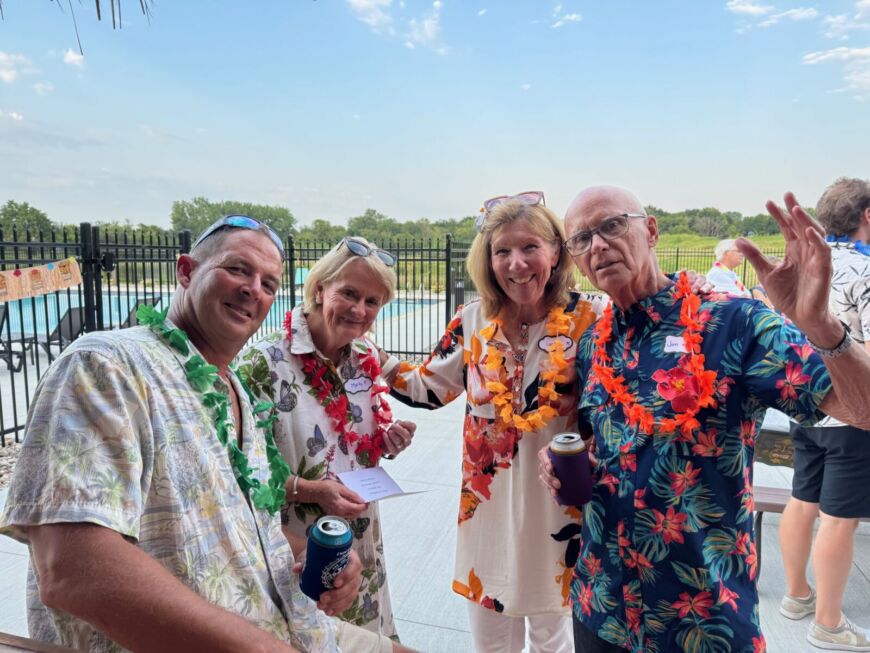 Residents enjoying outdoor social gathering at Siesta Hills Mankato with drinks and community atmosphere