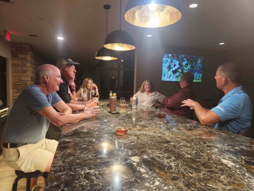 Siesta Hills clubhouse pub gathering space with residents socializing in Mankato Minnesota