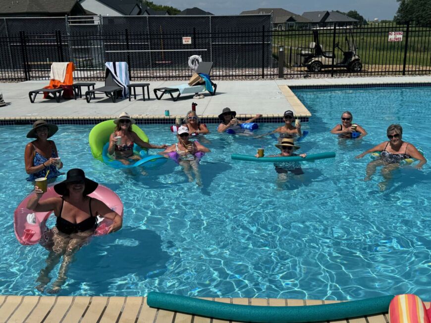 Siesta Hills outdoor heated pool with residents enjoying a summer afternoon in Mankato Minnesota