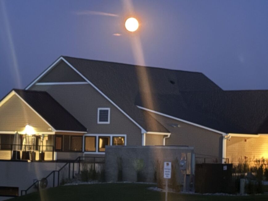 Siesta Hills clubhouse at night under a full moon in Mankato Minnesota