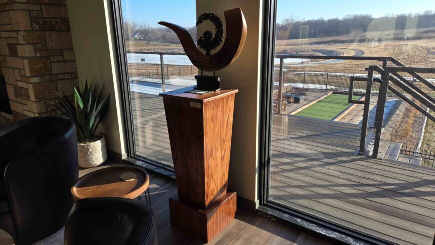 Artistic wood sculpture representing community values at Siesta Hills in Mankato Minnesota