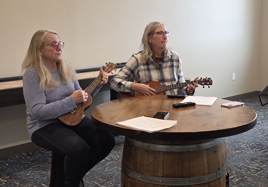 Residents playing ukulele together at Siesta Hills community gathering in Mankato Minnesota